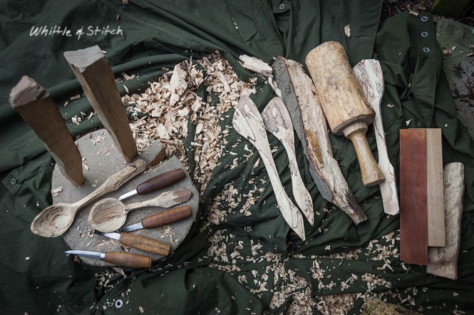 Spoon carving knives and hand carved spoon s in spalted Beech sitting on wooden block with club mallet and honing strop. Colour Landscape. © P. Maton 2015 whittleandstitch.net