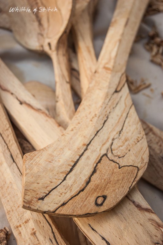Spalted Beech wood hand carved spatula by Peter Maton lying on cloth with wood shavings. Colour Landscape. © P. Maton 2014 whittleandstitch.net